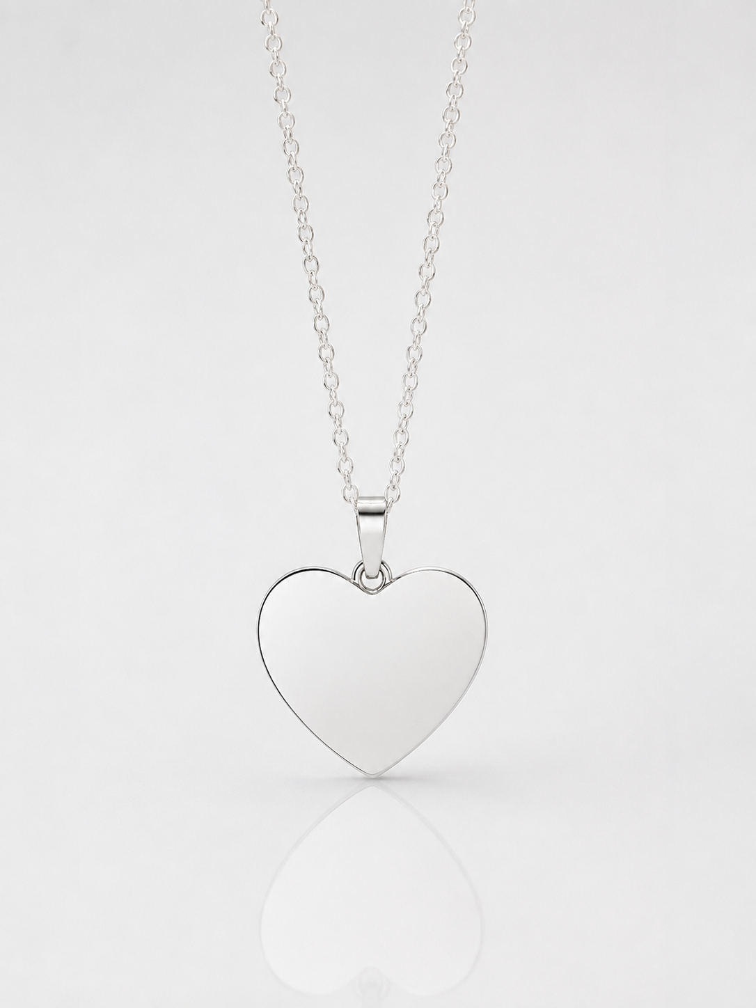 Placa Corazón Personalizable 33 x 25 mm en Plata 950 nacional.